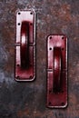 Handmade exclusive red leather door handles in the shape of the handle of a vintage suitcase Royalty Free Stock Photo