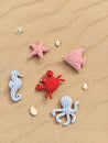 Handmade fabric toys on sandy background. Baby educational toys