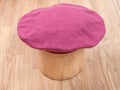 Handmade felt beret is molded on wooden hat block