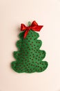 Handmade Felt Christmas Tree Ornaments with Bows on Pink Background Royalty Free Stock Photo