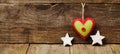 Handmade from felt heart, white stars on wooden background Royalty Free Stock Photo