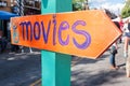 Handmade Festival Sign Says Movies And Points In Right Direction