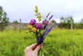 Handmade flower bouquet in a girls hand