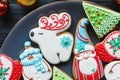 Handmade Gingerbread cookies for Christmas, New year on the plate on wooden table. Festive, sweet pastry, delicious biscuits. Royalty Free Stock Photo