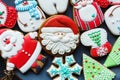 Handmade Gingerbread cookies for Christmas, New year on the plate on wooden table. Festive, sweet pastry, delicious biscuits. Royalty Free Stock Photo