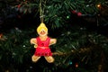 Handmade Gingerbread Girl Christmas Ornament on a Christmas Tree Royalty Free Stock Photo