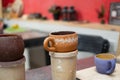 Handmade glazed clay mug made according to the master class Royalty Free Stock Photo