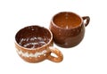 Handmade glazed clay mugs made according to the master class Royalty Free Stock Photo