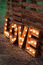 Handmade glowing love letters. modern wedding decoration outdoors