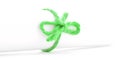 Handmade green string bow tied on white paper roll Royalty Free Stock Photo