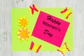 Handmade greeting card made of colored paper and wish Happy Women`s Day. Flat lay