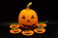 Handmade Halloween colored pumpkins isolated on black background. Studio shot.