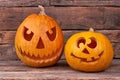 Handmade Halloween pumpkins on wooden background.