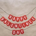 Handmade Happy Valentines Day red paper banner lettering message. Nice Holiay postcard, greeting card template. Empty space (