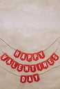 Handmade Happy Valentines Day red paper banner lettering message. Nice vertical holiay postcard, greeting card template. Empty