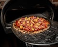 Handmade hawaiian pizza with fresh ingredients right out of the oven