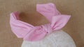 Handmade headband or hairband made out of fabric with pretty soft colors