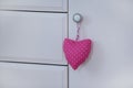 Handmade heart of scrim hanging on the wooden dresser