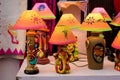 Handmade illuminated decorative table lamps is displayed in a street shop for sale. Indian handicraft and art