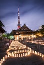 Handmade japanese rice paper lanterns aligned in circles illuminating the ground of the Zojoji temple near the Tokyo Tower during Royalty Free Stock Photo