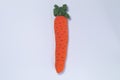 Handmade knitting carrot solated on white background