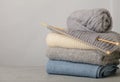 Handmade, knitting and woolen thread. Pile of knitted clothes bl