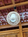 Handmade lamp craft bamboo and wood with wood background traditional house