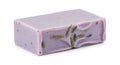 A handmade lavender-colored soap bar features embedded dried lavender buds Royalty Free Stock Photo