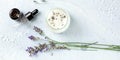 Handmade lavender scented candle with essential oil, flowers, wax and wicks, panoramic flat lay Royalty Free Stock Photo