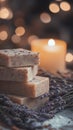 Handmade lavender soap with candle and bokeh light background Royalty Free Stock Photo