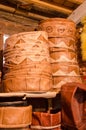 Handmade leather poufs stacked high in small traditional craft shop in soukh of Fez, Morocco Royalty Free Stock Photo