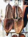 Handmade leather shoes hanged in the bazaar