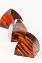 Handmade luxury bonbons with orange splashes