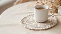A handmade macrame coaster placed on a light beige table picture Royalty Free Stock Photo