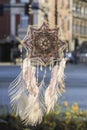 Handmade mandala God`s Eye dream catcher with white peacock feat