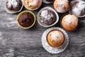 Handmade muffins close up on a black wooden table