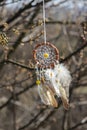 Handmade native american dream catcher on background of rocks an Royalty Free Stock Photo