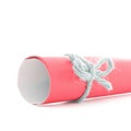 Handmade natural cord node tied on red paper scroll isolated Royalty Free Stock Photo