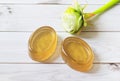 Handmade natural honey ginger soap on white wood background