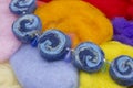 Handmade necklace made of dry natural merino bright colorful wool beads, felt dried balls. Colored handmade beads. Blue, orange, w Royalty Free Stock Photo