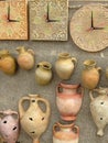 Handmade Old Brown Clay Pottery Traditional Ceramics Mugs Souvenirs Street Handicraft Market. Vintage vessels jugs and wall clocks Royalty Free Stock Photo