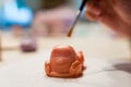 Handmade old car shaped soap - decorated with a brocade brush - at art workshops for children - very shallow depth of field