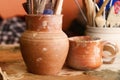 Handmade old clay pots with pencils Royalty Free Stock Photo