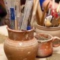 Handmade old clay pots with pencils Royalty Free Stock Photo