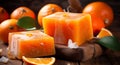 Handmade orange soap with fresh oranges and leaves on wooden background. Atmospheric beautiful spa background