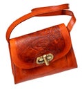 Orange toned embossed leather handbag on white