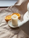 Handmade organic molded soy wax candle with wood wick, dry citrus on eco paper. Hand poured, aromatherapy relaxation,