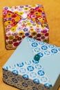 Handmade origami gift boxes with decorative buttons