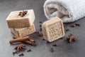 Handmade ornamental soap with cinnamons and anise on black background, product of cosmetics and body care