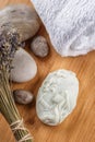 Handmade ornamental soaps with lavender bunch and stones on wooden board, product of cosmetics or body care Royalty Free Stock Photo